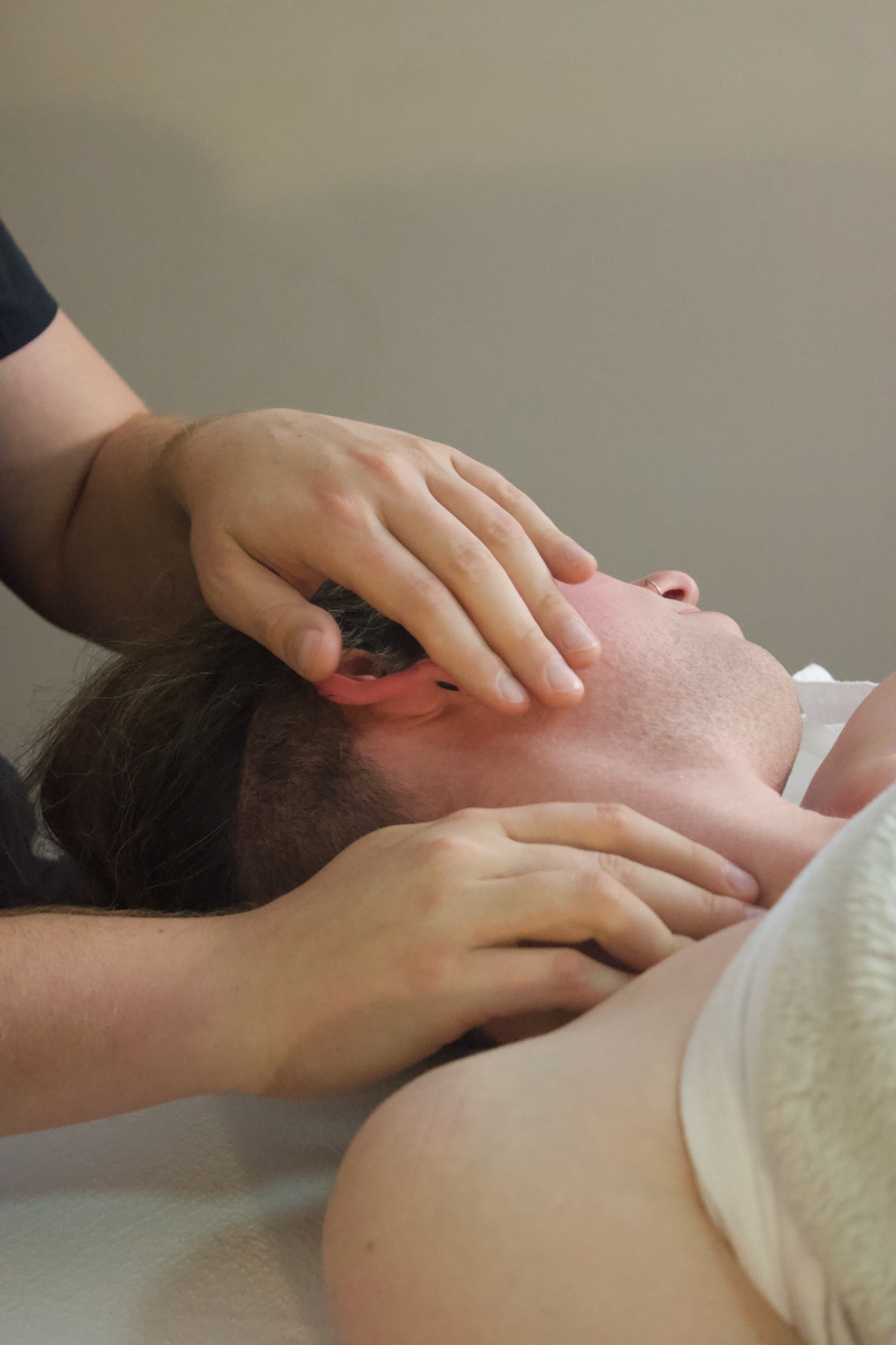 Marci working on a client's neck and jaw